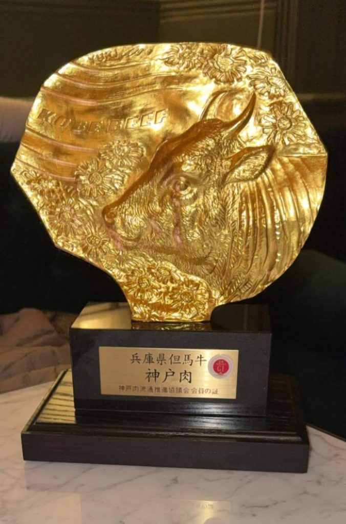 The official bronze Kobe Beef certification trophy on display at Aki, a top Kobe beef restaurant in London.