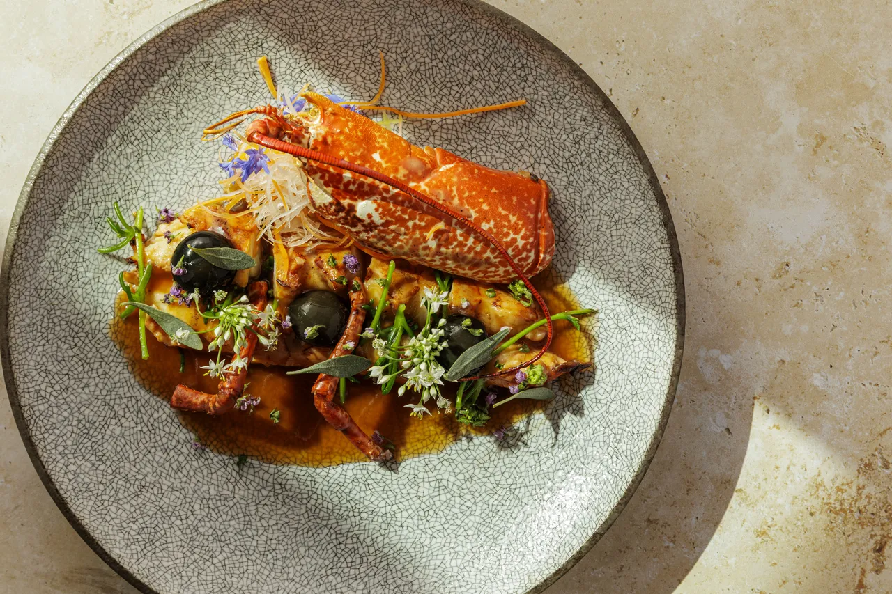 Robata Grill in London - Canadian Lobster enrobed in Kobe fat, foie gras mochi, tomato lobster ponzu, Japanese herbs.