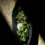 Japanese spinach salad with zero-mile plants and spices grown inside Aki's 80 micro farms, a farm to table restaurant in London