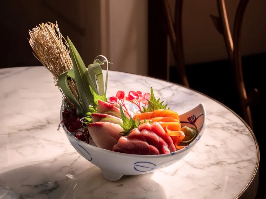 Sashimi platter at Aki London featuring Portuguese blue fin tuna akami, chu toro, otoro, with 30‑year‑aged soy sauce and fresh root wasabi.